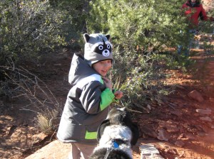 Bongo meeting a boy with a raccoon hat