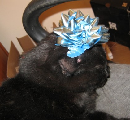 Scratchy with a blue bow on his head