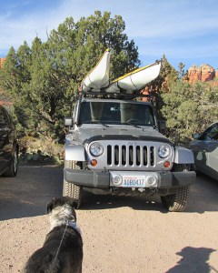 Parked vehicle with kayaks on top