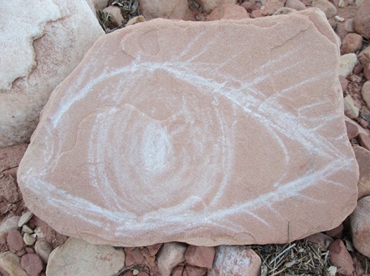 An eye drawn on a rock