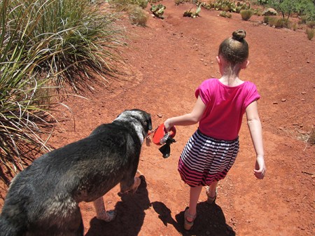 Bongo and the girl walking down the trail